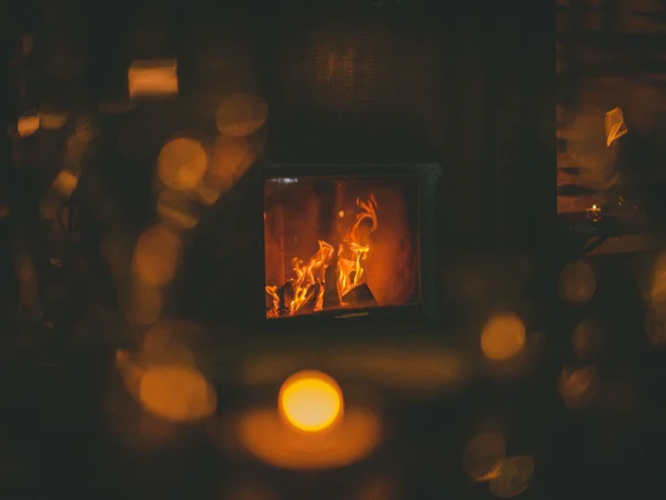 Gasthof Weisskugel in Vent: family-run since the beginning Burning fireplace in a dimly lit room with a cozy atmosphere