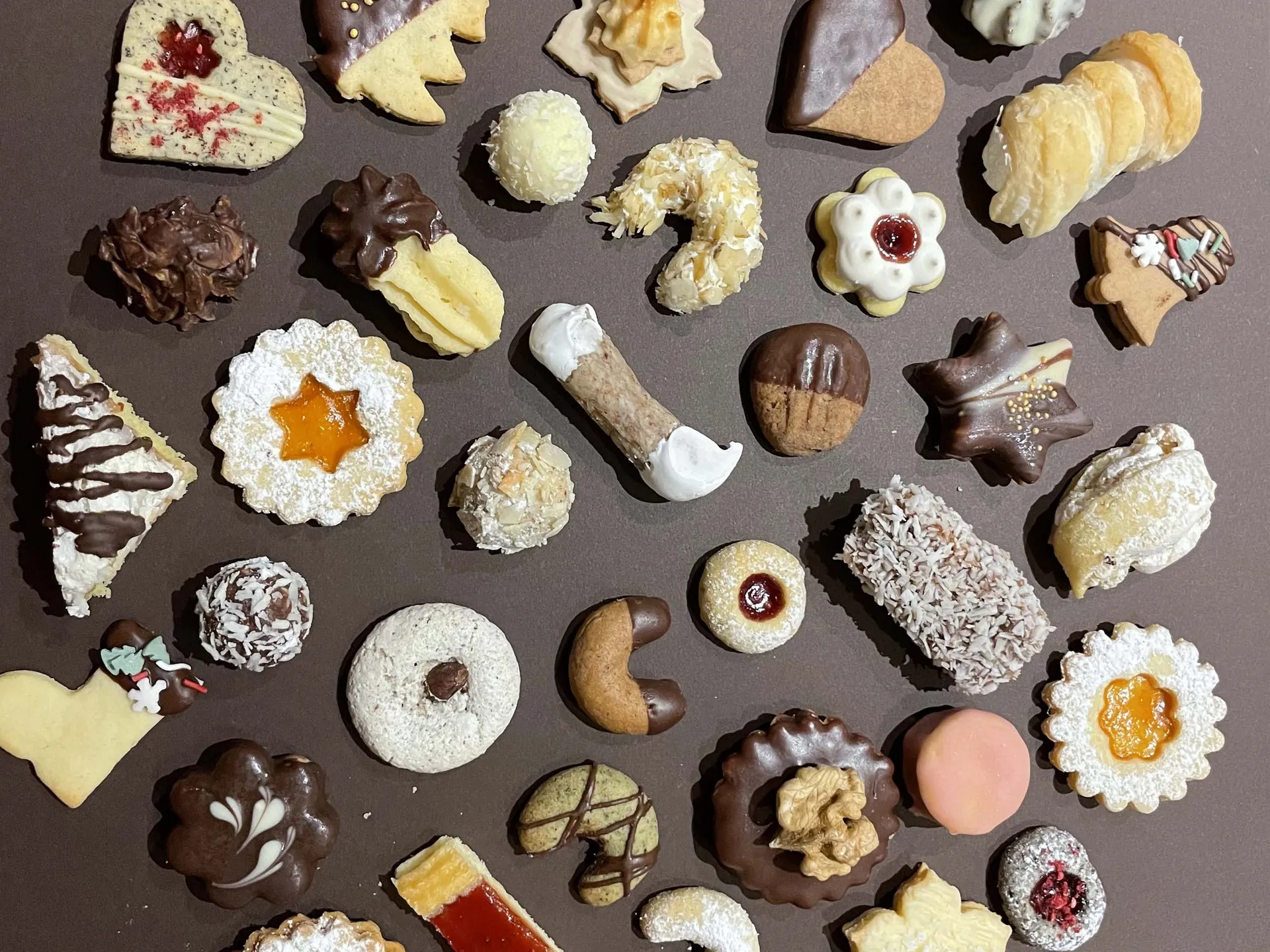 Weisskugel: your accommodation in Tyrol Assorted Christmas cookies decorated with chocolate, powdered sugar and jam on a tray