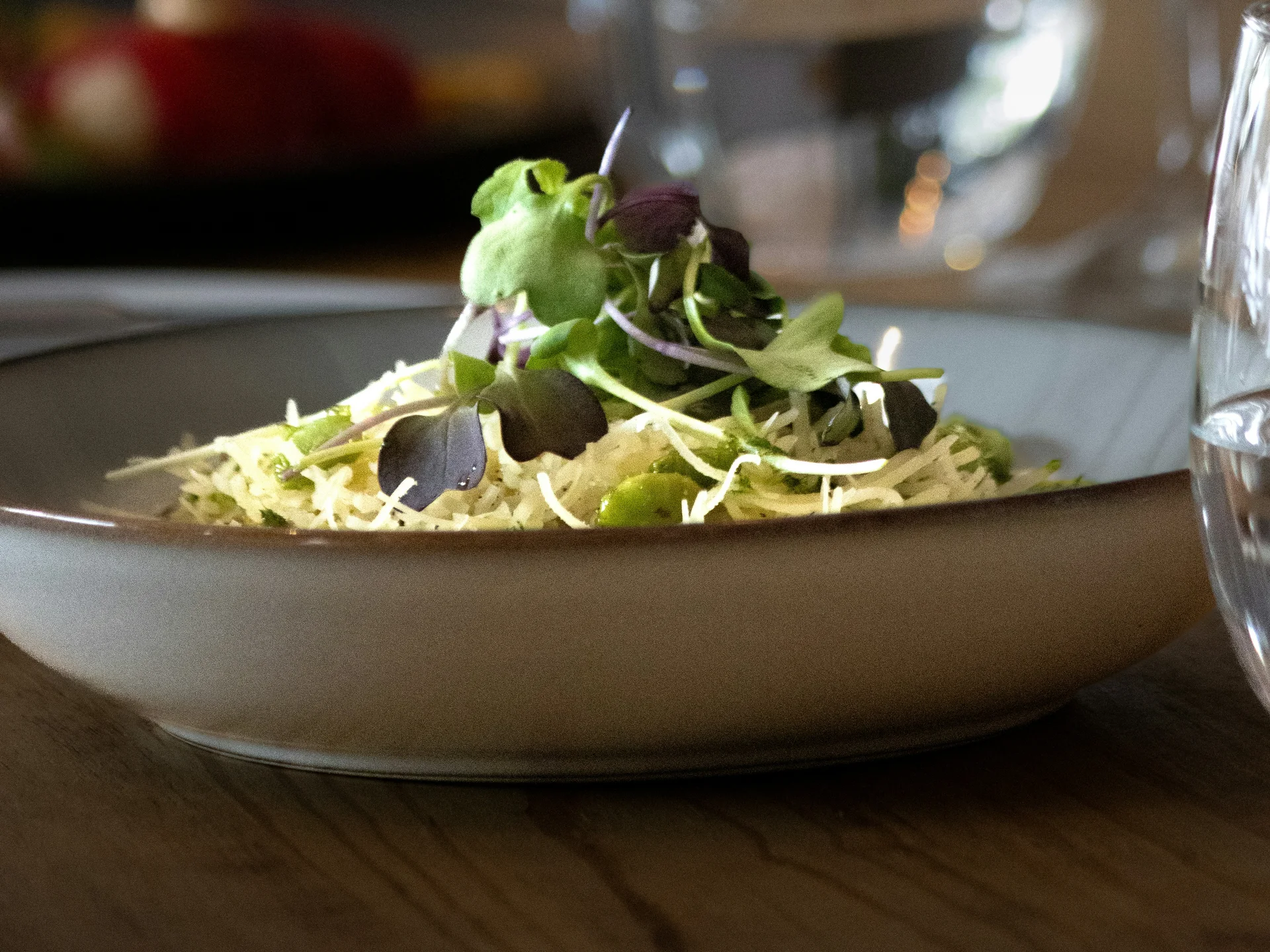Gasthof Weisskugel: your authentic restaurant in Vent Plate of salad with sprouts and green leaves on a set dining table